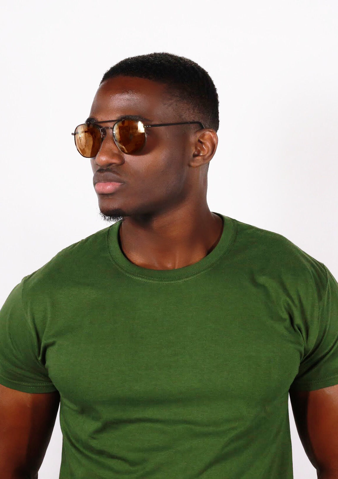 suave black man in green shirt wearing brown princeton Glasses